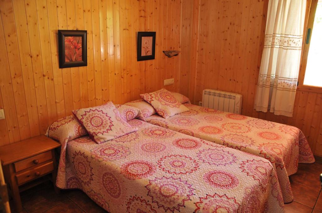 Łóżko lub łóżka w pokoju w obiekcie Alojamientos Rural Tejerina