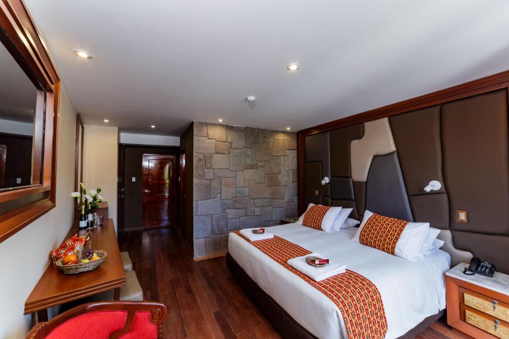 Cama o camas de una habitación en Yawar Inka Hotel