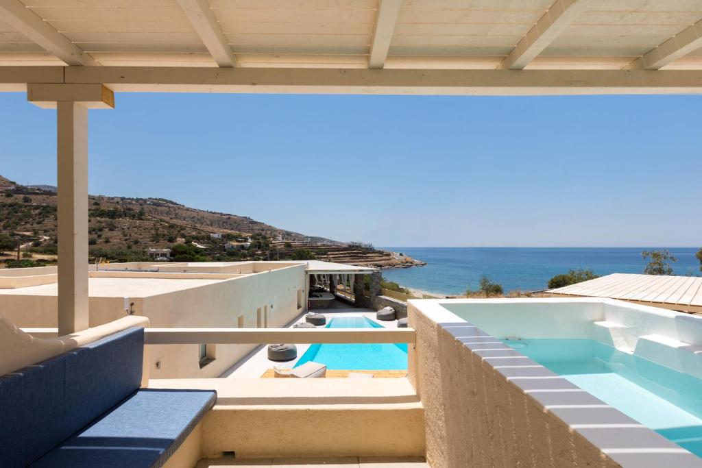 a view of the ocean from the balcony of a house at Anamar Kea Boutique in Koundouros
