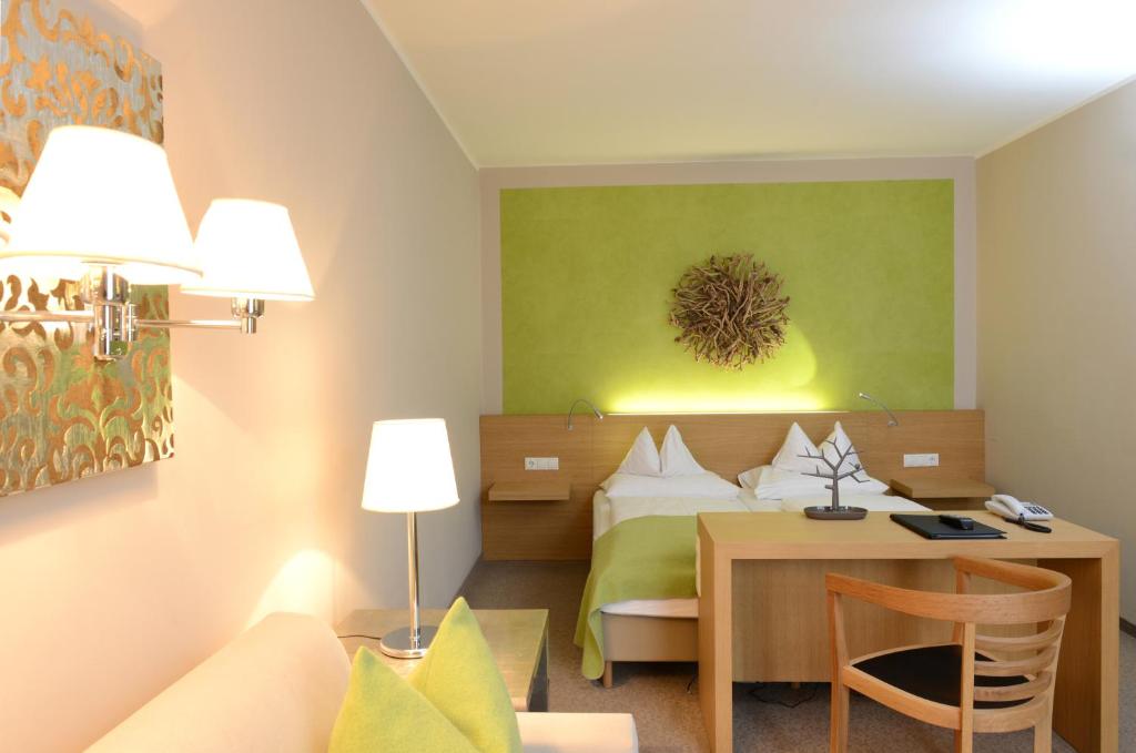 Postel nebo postele na pokoji v ubytování Hotel Moserhof