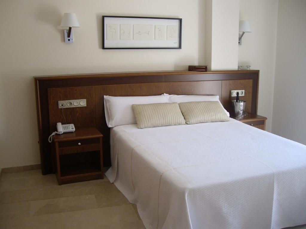 Postel nebo postele na pokoji v ubytování Hotel San Sebastián Hospedería