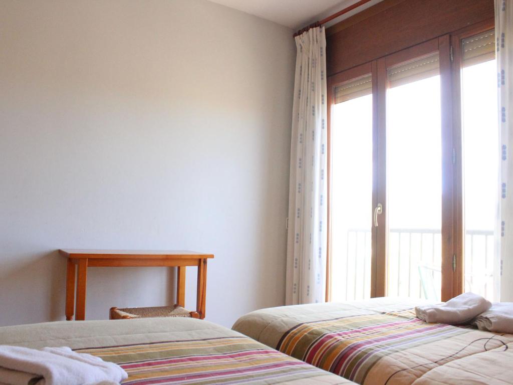 Postel nebo postele na pokoji v ubytování Hotel Casa Domenc