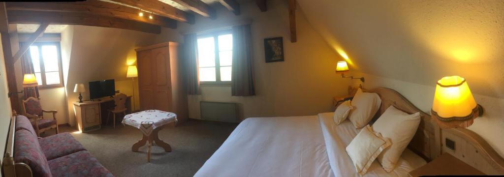 Postel nebo postele na pokoji v ubytování Hotel et Spa du Scharrach