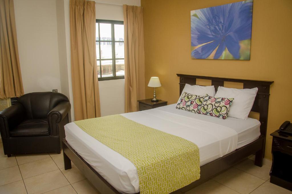Postel nebo postele na pokoji v ubytování Hotel Residencial Cervantes