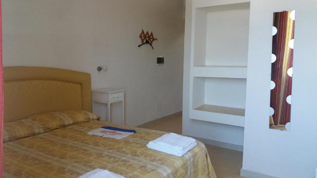 Postel nebo postele na pokoji v ubytování Villa Adele Ponza