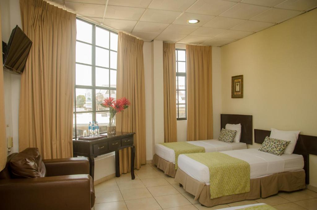 Postel nebo postele na pokoji v ubytování Hotel Residencial Cervantes