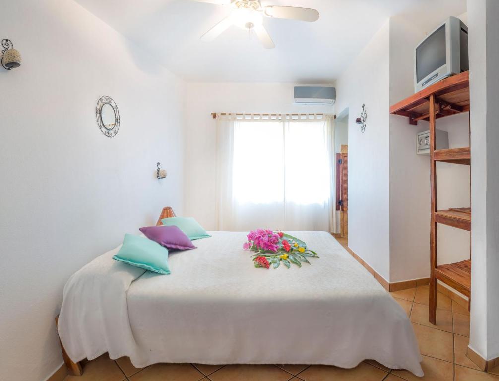 Postel nebo postele na pokoji v ubytování Hotel Laguna del Cocodrilo