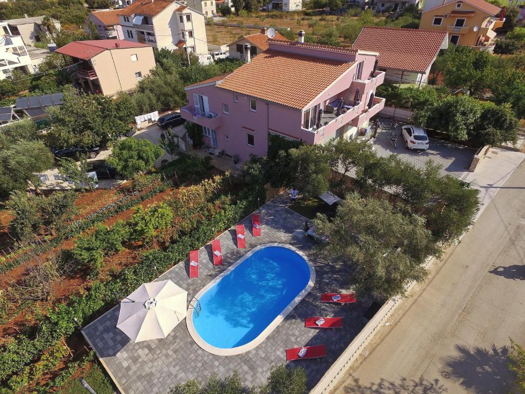 an aerial view of a house with a swimming pool at Apartment with private pool in Sukošan