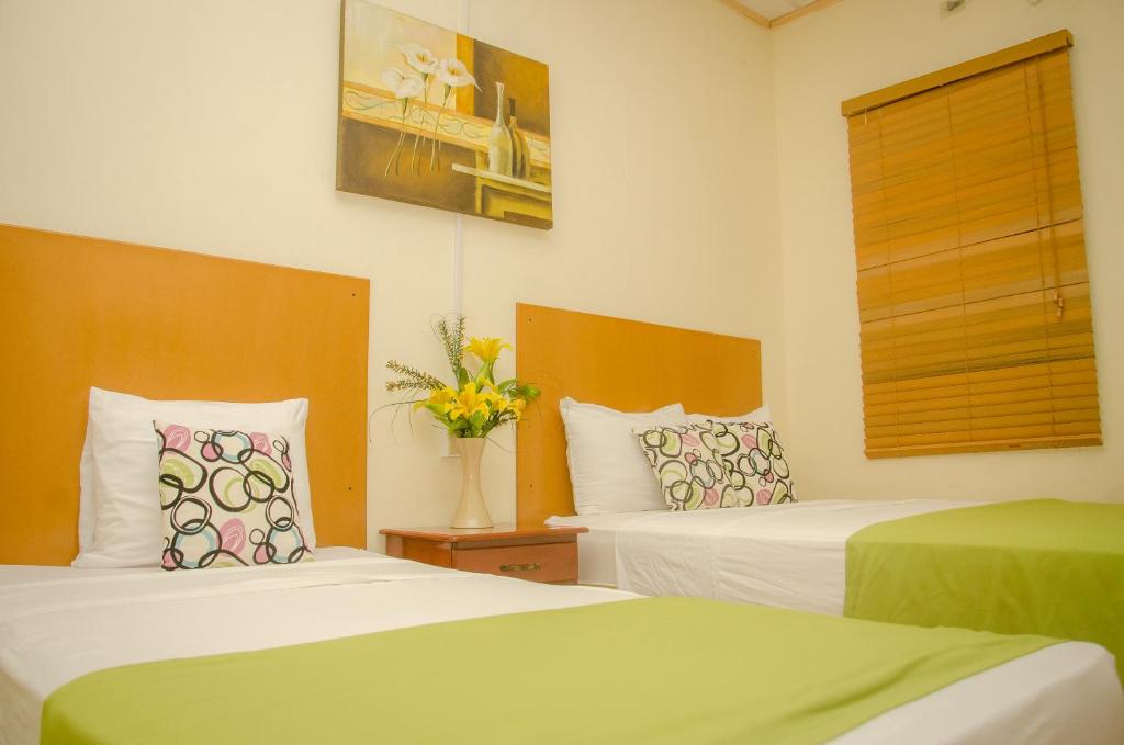 Postel nebo postele na pokoji v ubytování Hotel Residencial Cervantes