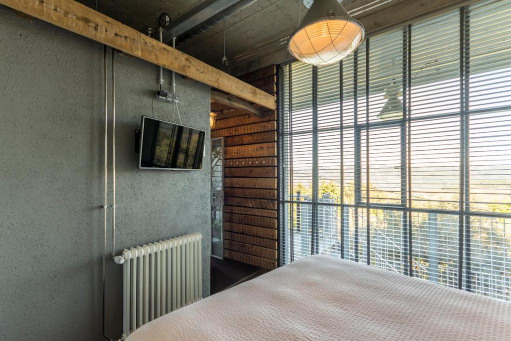 Een bed of bedden in een kamer bij Plano5 - Robust Design