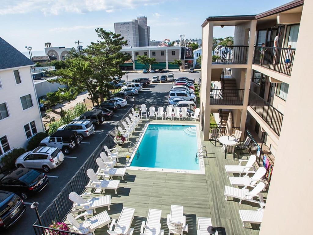 a view of a pool from the balcony of a hotel at Beach View Hotel in Rehoboth Beach