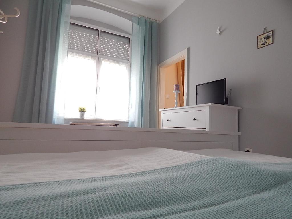 Postel nebo postele na pokoji v ubytování Ferencesek apartman