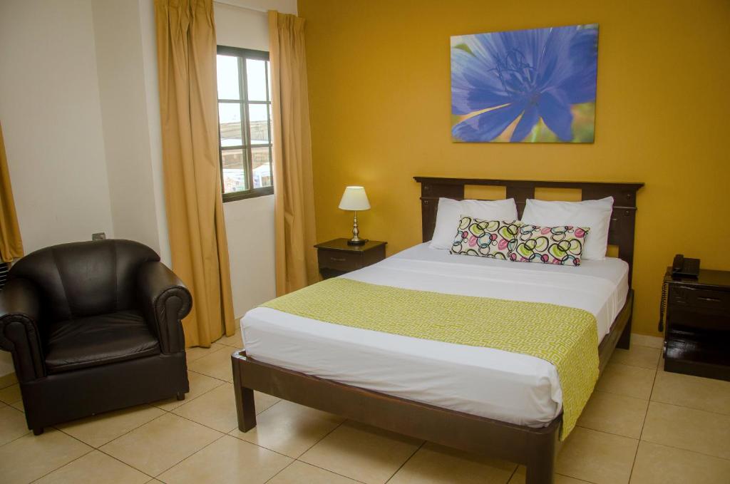 Postel nebo postele na pokoji v ubytování Hotel Residencial Cervantes