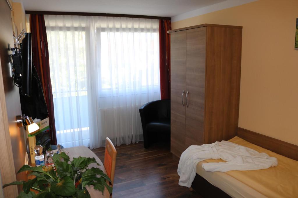 Postel nebo postele na pokoji v ubytování Hotel Brigitte