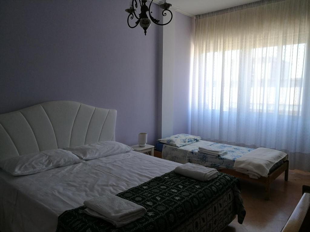 Postel nebo postele na pokoji v ubytování B&B Domus Lupiae