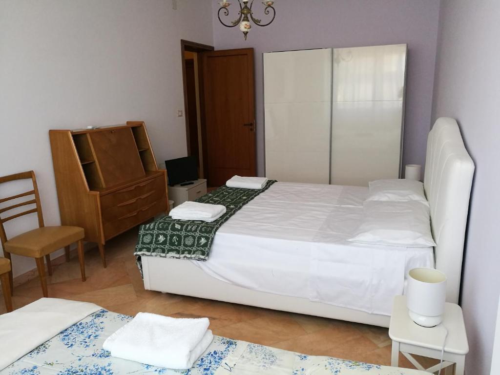 Postel nebo postele na pokoji v ubytování B&B Domus Lupiae