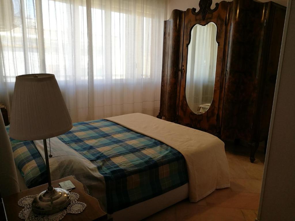 Postel nebo postele na pokoji v ubytování B&B Domus Lupiae