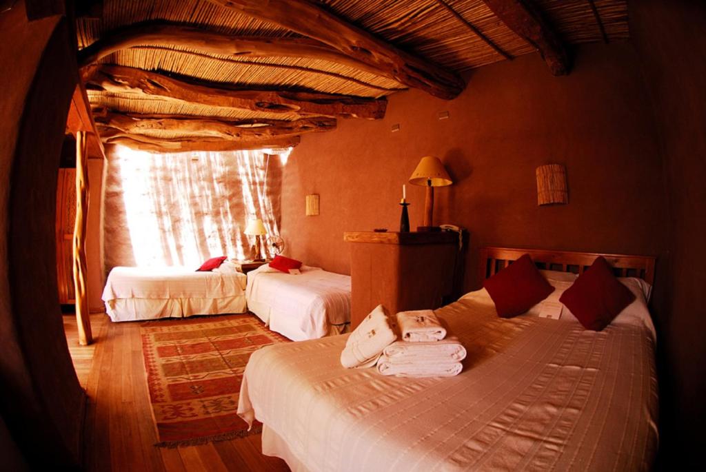 Postel nebo postele na pokoji v ubytování Hotel Kimal