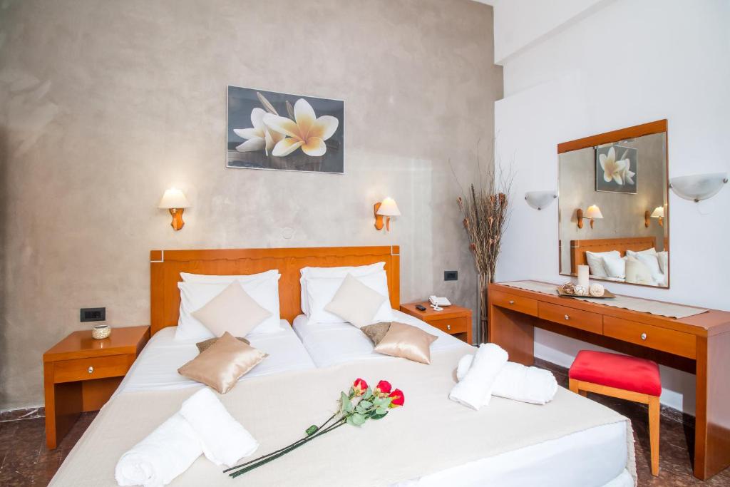 Postel nebo postele na pokoji v ubytování Kahlua Hotel Apartments
