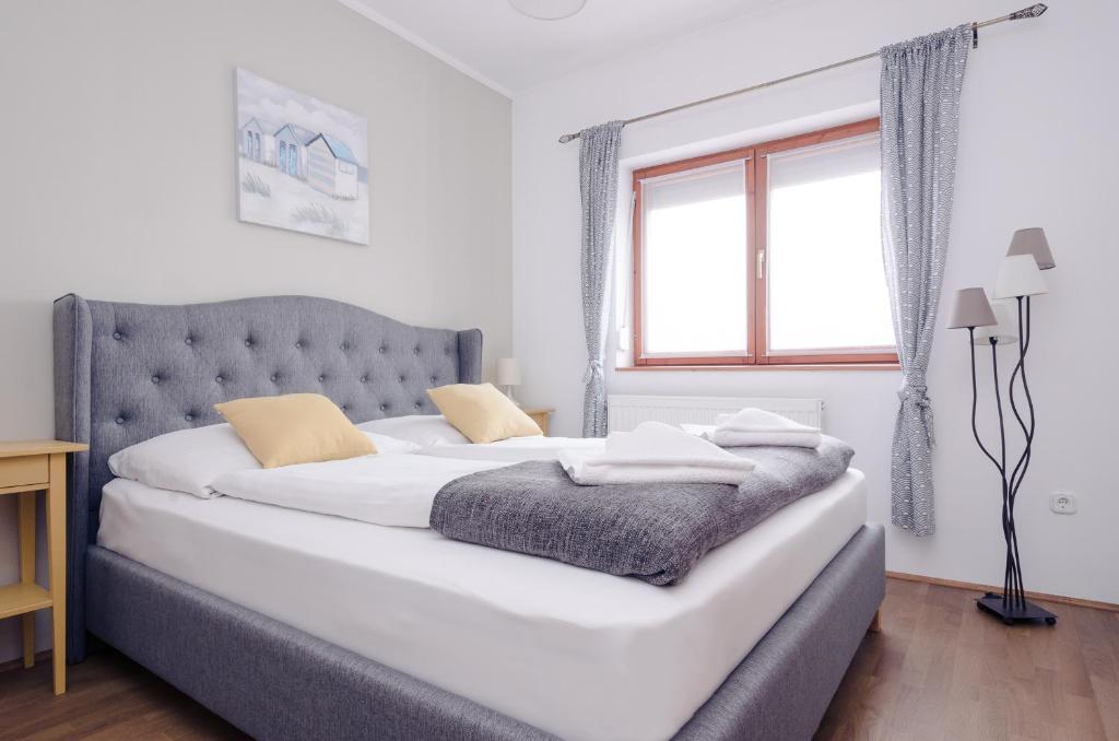 Łóżko lub łóżka w pokoju w obiekcie Casa Lavanda