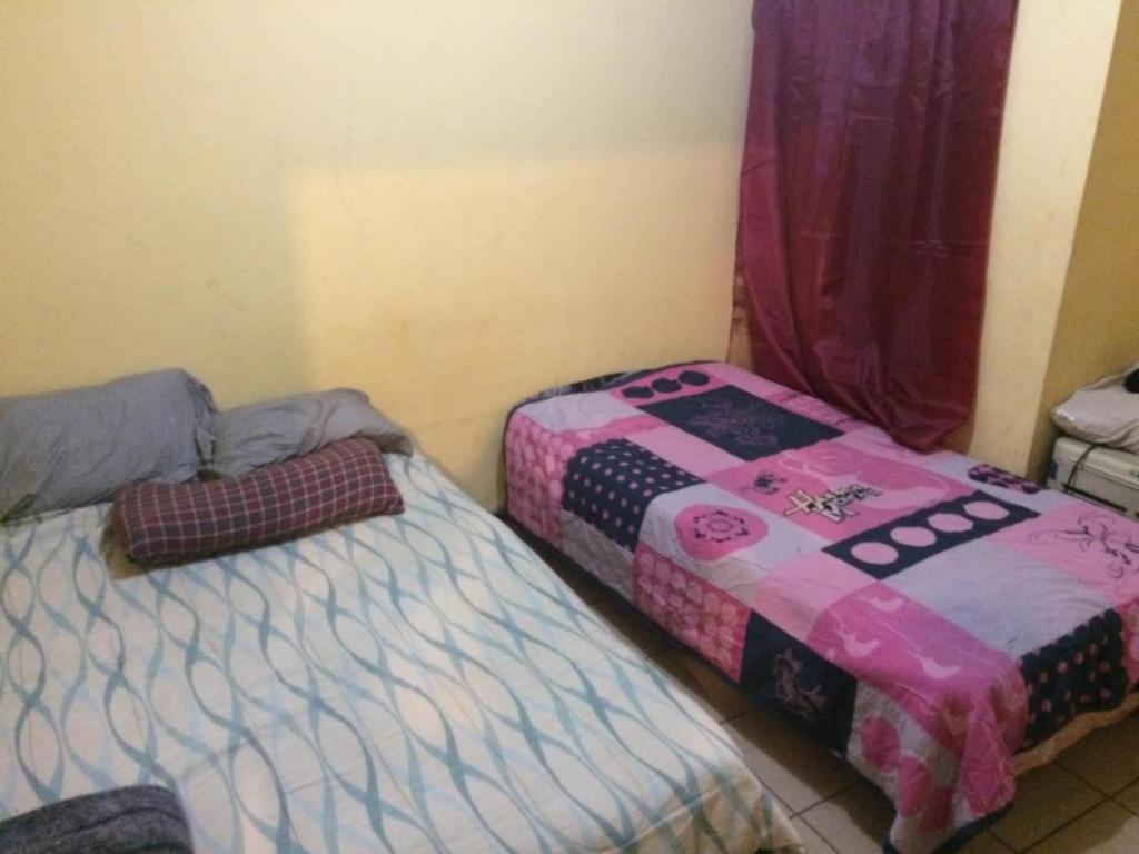 Postel nebo postele na pokoji v ubytování Blanquita Apartment