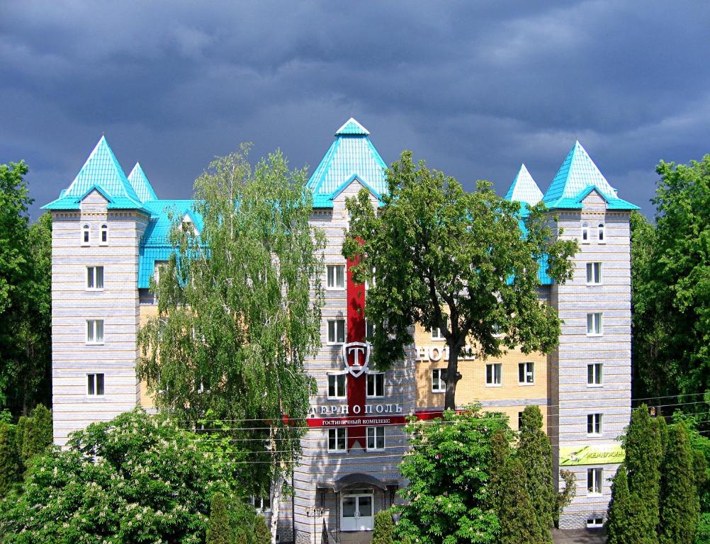 a large building with blue turrets on top of it at Hotel Ternopol in Zelenodolsk