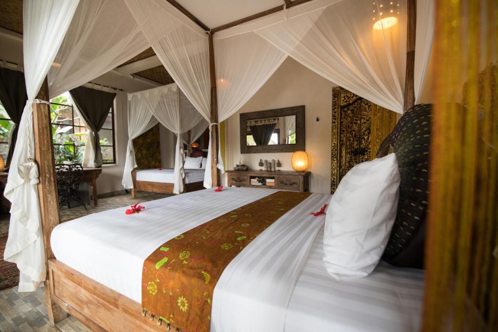 Postel nebo postele na pokoji v ubytování Villa Kalisat Resort