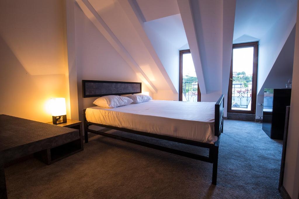 Postel nebo postele na pokoji v ubytování Hotel Opinion