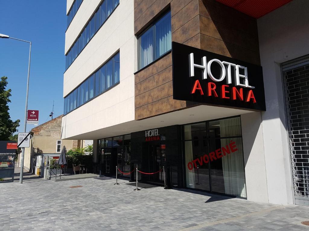 a hotel arena sign on the side of a building at Hotel Arena in Trnava