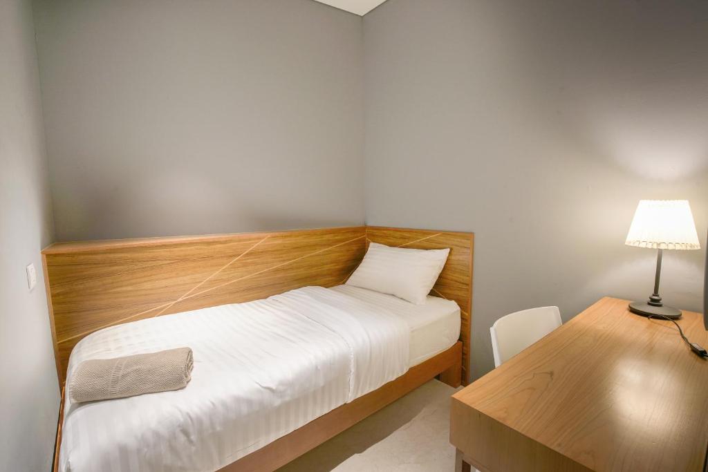 Postel nebo postele na pokoji v ubytování The Bed KLCC