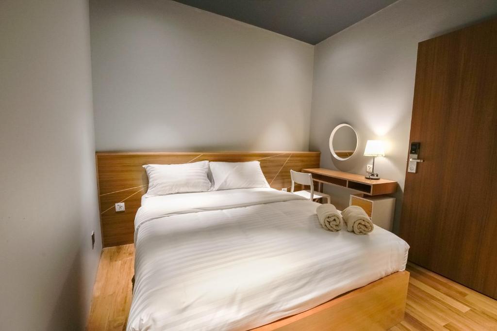Postel nebo postele na pokoji v ubytování The Bed KLCC