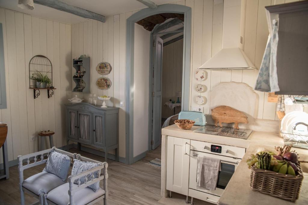 a kitchen with a sink and a stove top oven at Casa Jacinta con jacuzzi in Adeje