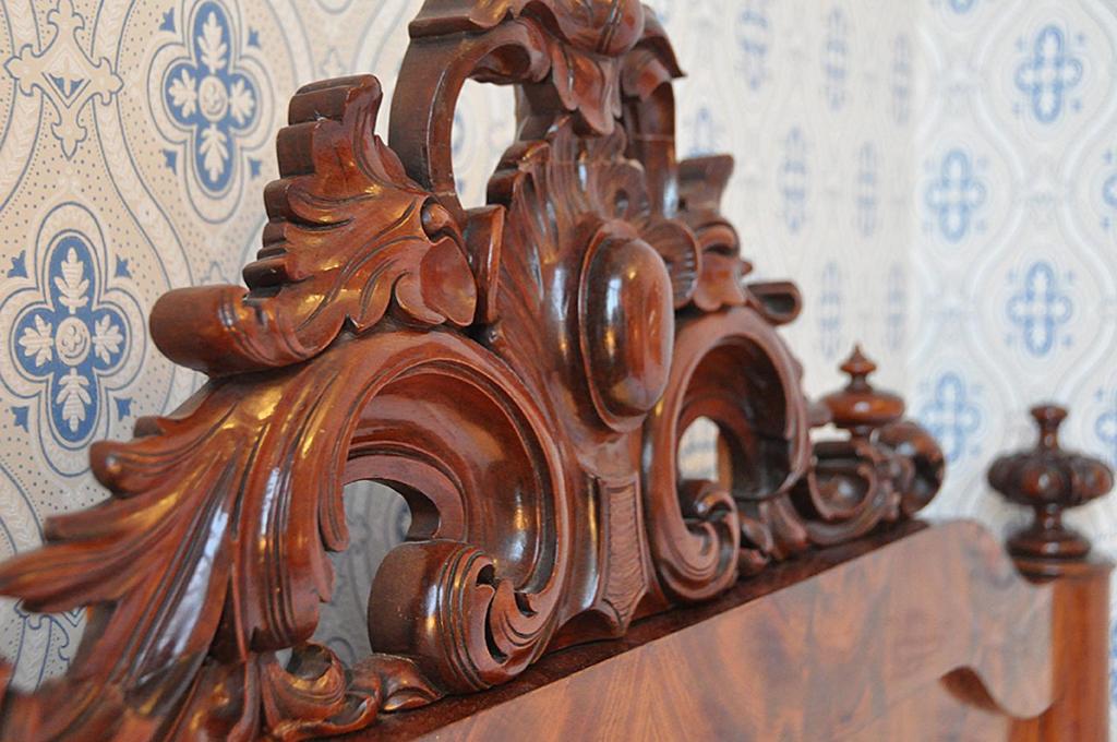 a close up of a wooden headboard of a bed at Laholms Stadshotell in Laholm