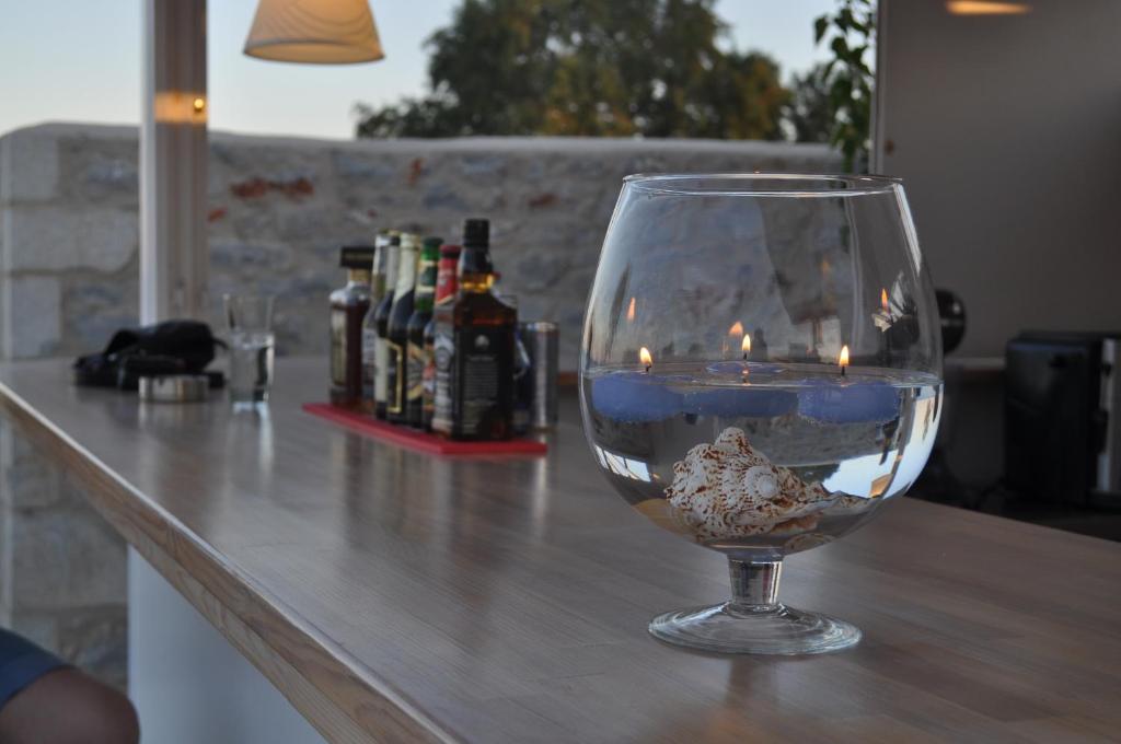 a wine glass sitting on top of a counter at Thirides Beach Resort in Gythio