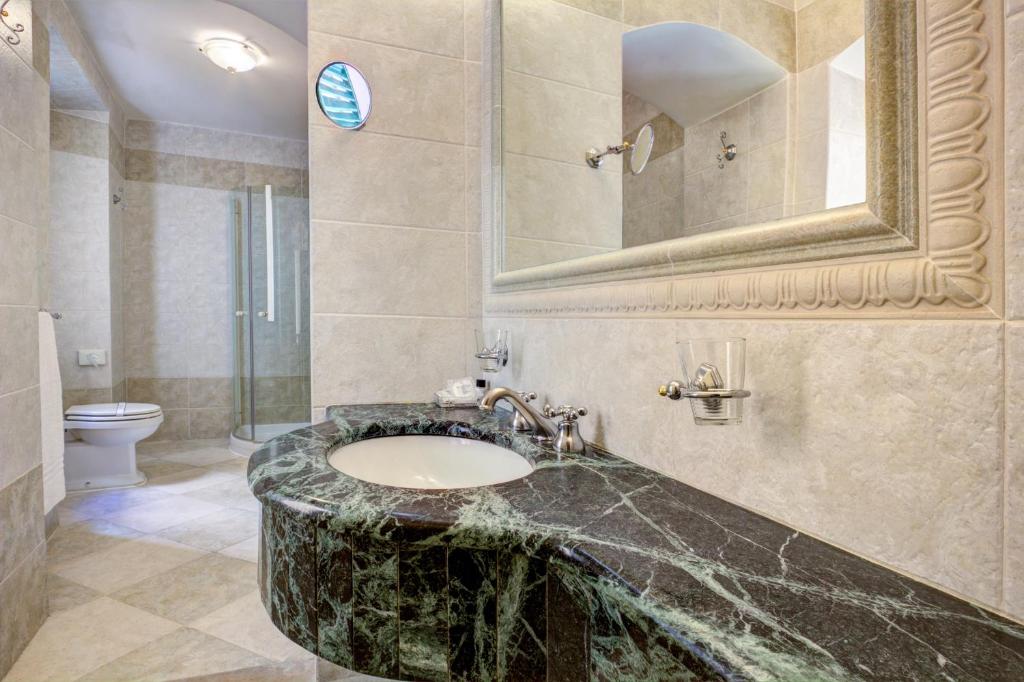 Koupelna v ubytování Hotel La Locanda