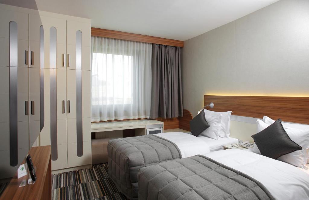Postel nebo postele na pokoji v ubytování Mimi Hotel Ankara