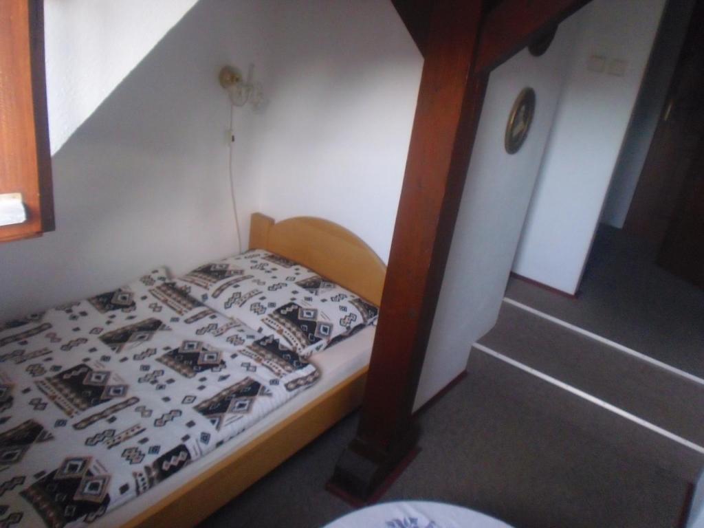 Postel nebo postele na pokoji v ubytování Penzion Podhradí