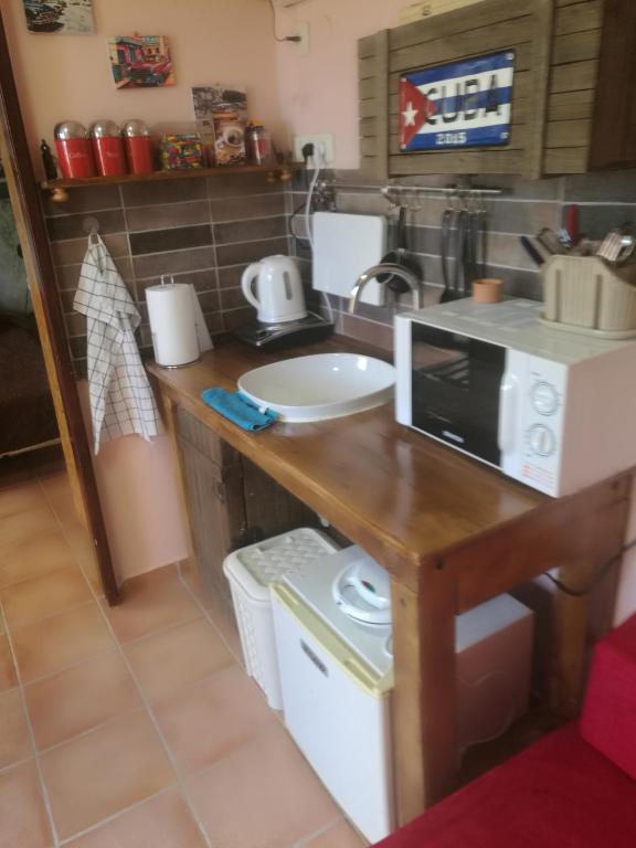 Televiisor ja/või meelelahutuskeskus majutusasutuses Casa Rosa