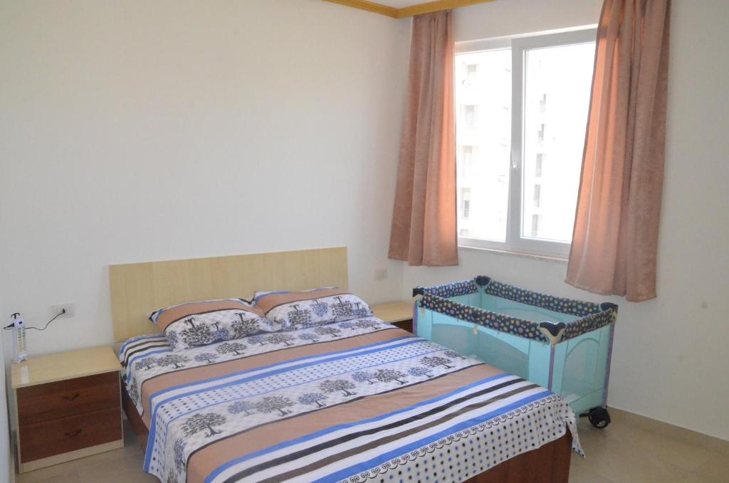 Postel nebo postele na pokoji v ubytování Everest Apartments Shengjin