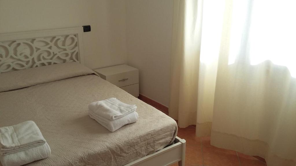 Posteľ alebo postele v izbe v ubytovaní Don Diego Apartment Orosei
