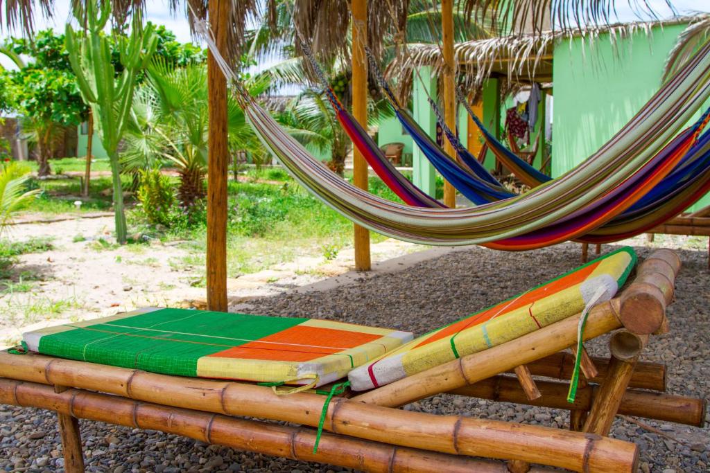 a group of hammocks and a hammock at La Casa de Jessy in Máncora