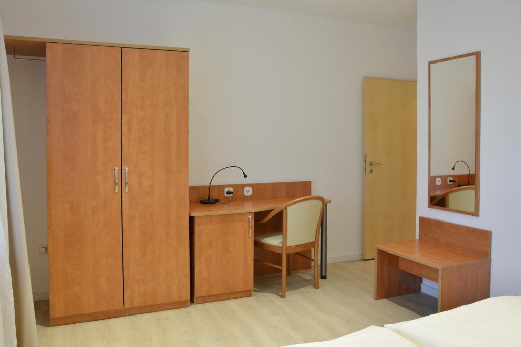 Postel nebo postele na pokoji v ubytování Boutique Hotel Wolfsburg