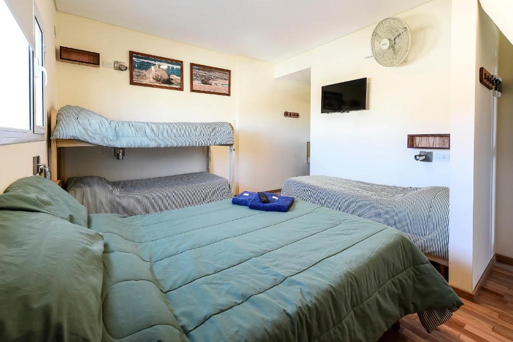 Postel nebo postele na pokoji v ubytování La Tosca Hostel