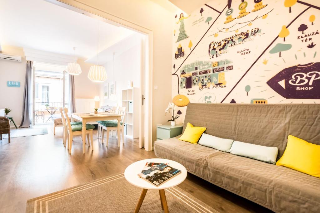 a living room with a couch and a table at Mile's Home in Budapest