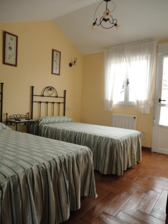 Postel nebo postele na pokoji v ubytování Casa Os Batans