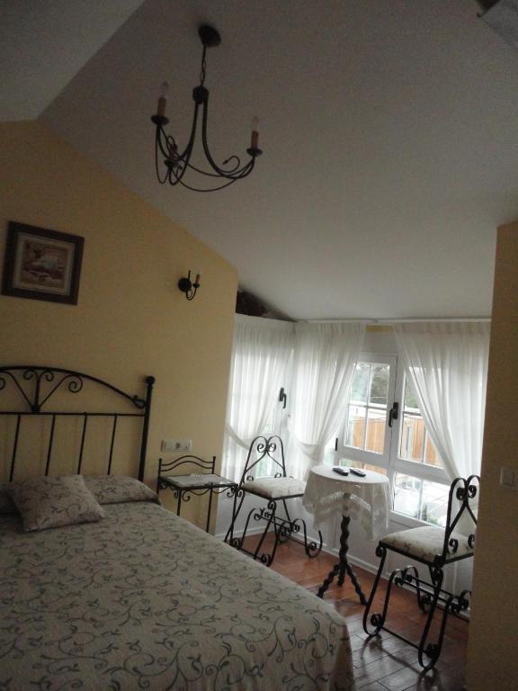 Postel nebo postele na pokoji v ubytování Casa Os Batans