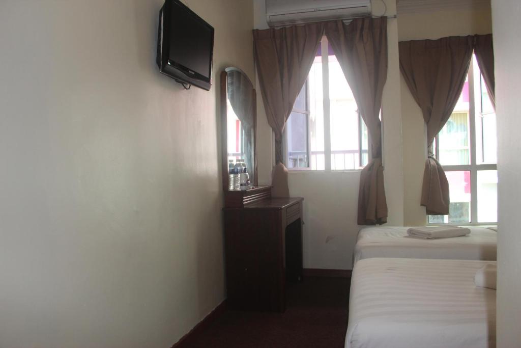 TV a/nebo společenská místnost v ubytování Alonto Hotel