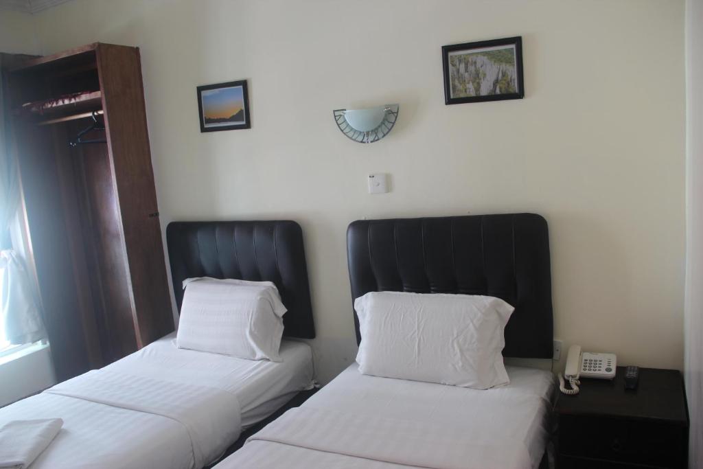 Postel nebo postele na pokoji v ubytování Alonto Hotel
