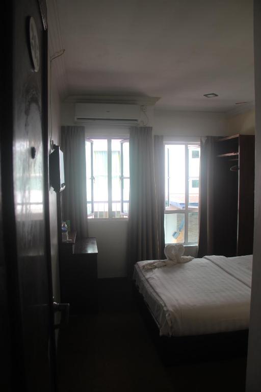 Postel nebo postele na pokoji v ubytování Alonto Hotel