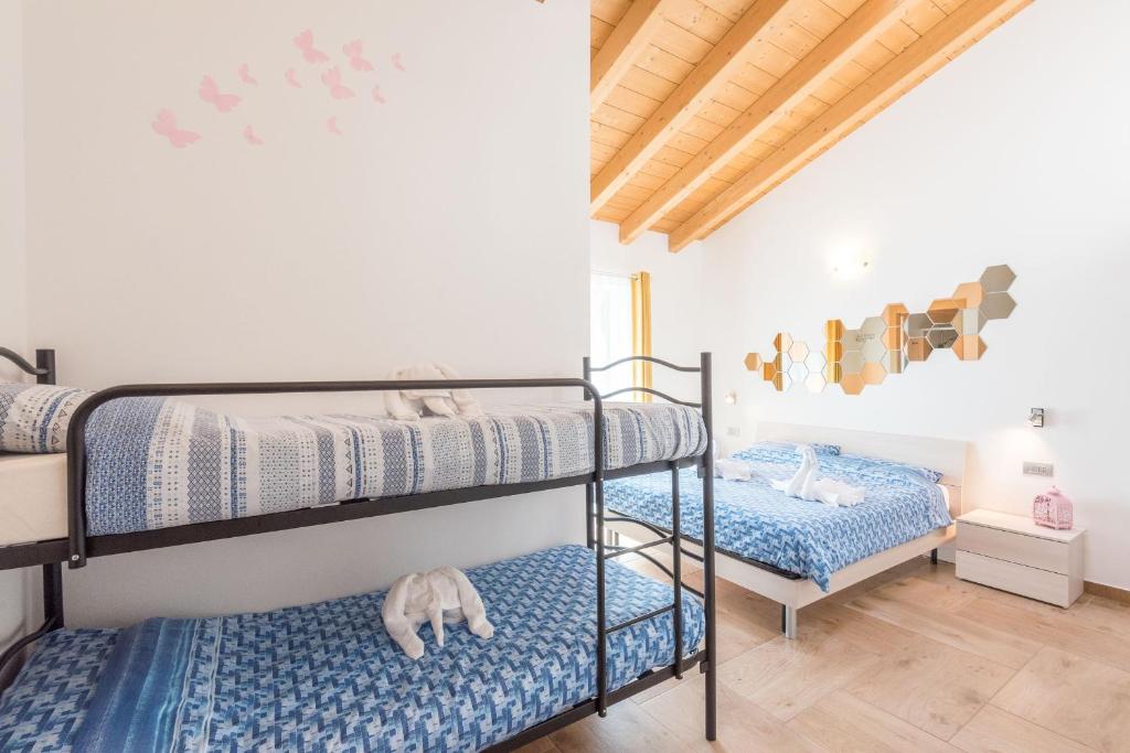 Postel nebo postele na pokoji v ubytování TeglioVacanze